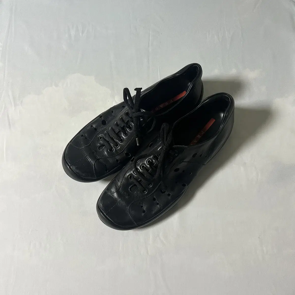 Prada sports punching lace up shoes